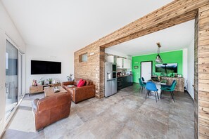 Basic Apartment | Living area | 35-inch TV with digital channels - Castelletto Apts by Wonderful Italy (Polpenazze del Garda)
