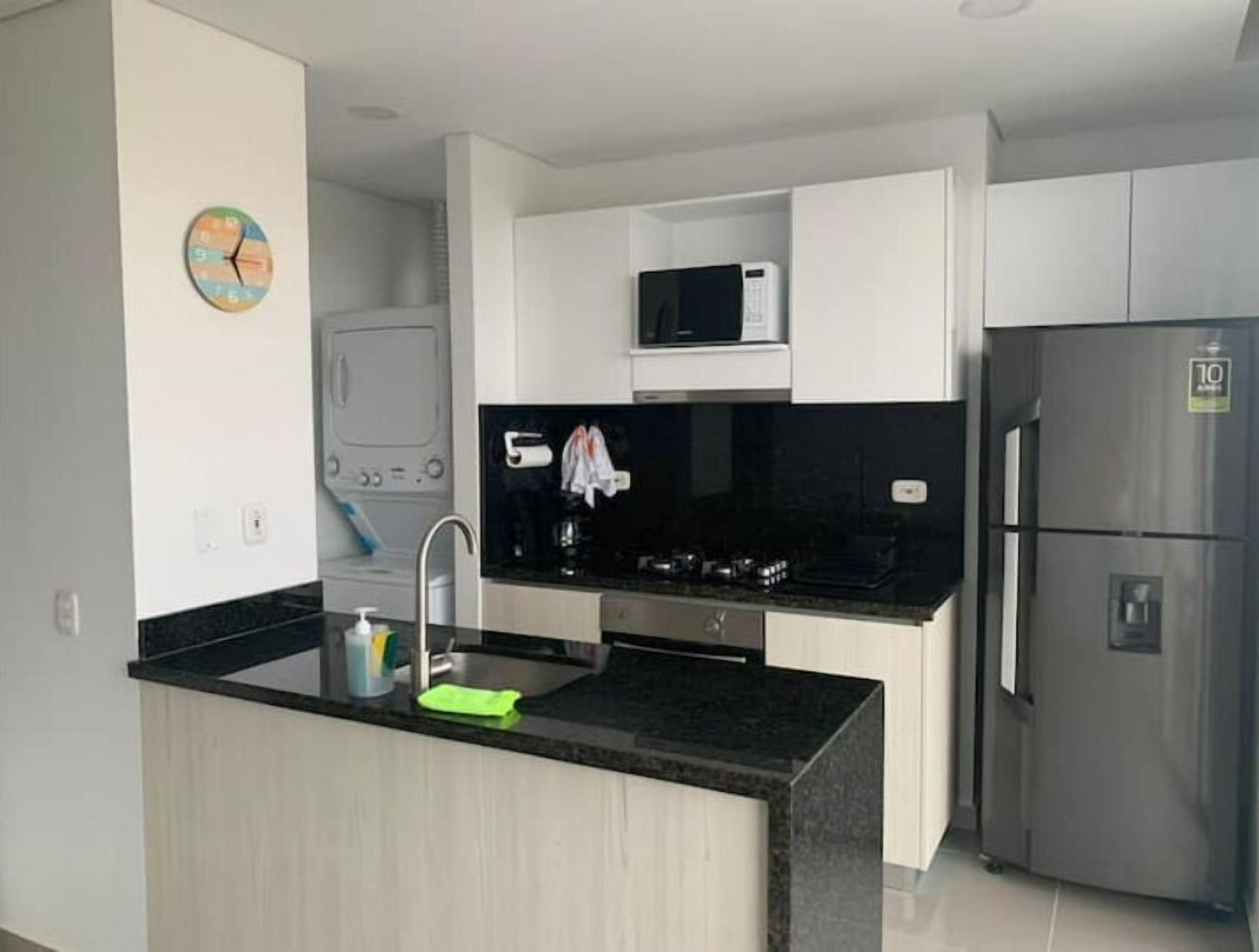 Microwave, coffee/tea maker, cookware/dishes/utensils, dining tables