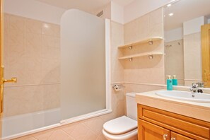 Bathtub, hair dryer, towels