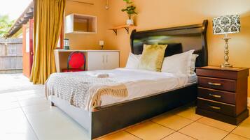 Deluxe Studio Suite, 1 Queen Bed | Laptop workspace, WiFi (free), individually decorated