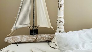 A lamp with a sail design on a table. - Coastal Casita by the River (New Bern)