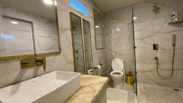 Shower, hair dryer, towels, soap