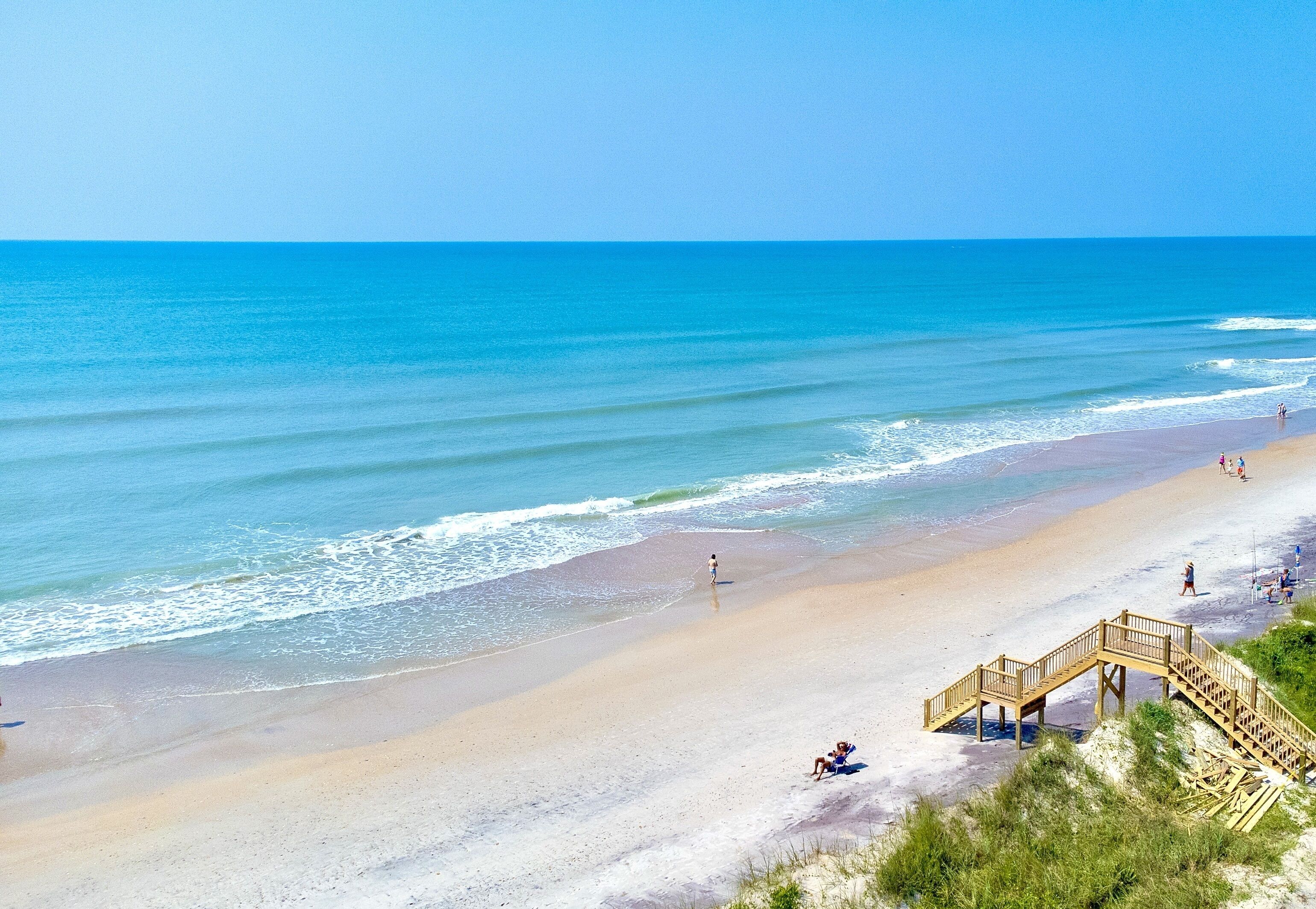 On the beach, sun-loungers