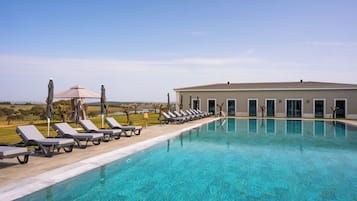 Outdoor pool, pool umbrellas, sun loungers