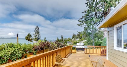 Water view retreat with scenic deck, grill, yard, fireplace, board games, & W/D
