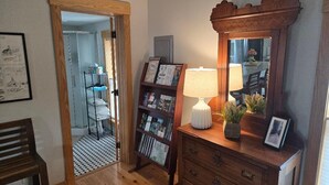 A wooden dresser with drawers, a mirror, and a lamp. - Located in beautiful/historic downtown Peninsula in the heart of a National Park (Peninsula)
