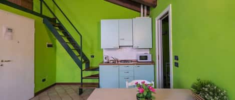 Fridge, microwave, coffee/tea maker, cookware/dishes/utensils