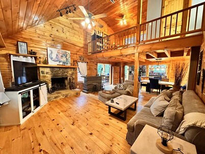 Secluded log cabin home located on 13 acres with salt water pool & jacuzzi. 