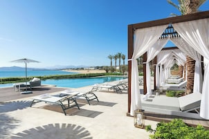 Outdoor pool, open 9:00 AM to 9:00 PM, cabanas (surcharge), sun loungers