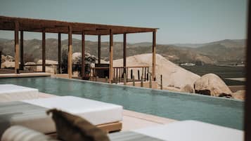Outdoor pool, open 9:00 AM to 9:00 PM, pool loungers