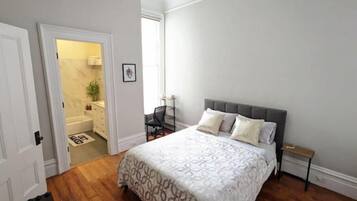 1 bedroom, desk, iron/ironing board, travel crib