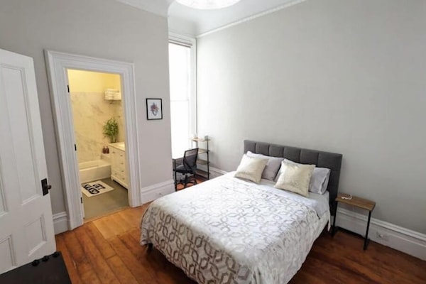 Master bedroom has queen bed, private bath, small desk, and custom built closet.