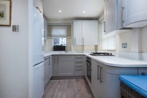 Fridge, microwave, oven, stovetop - PBC | One Bedroom Apartment in Chelsea - RCG (London)