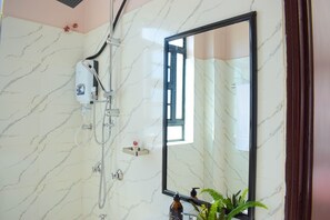Shower, towels, soap, toilet paper