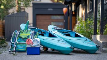 Kayaks and a cooler are available for guests to enjoy water-based activities.