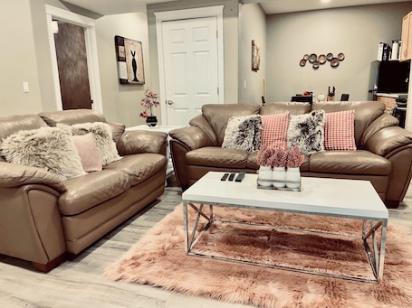 TV, fireplace, Netflix, streaming services. Cozy 2 bedroom basement with 2 beds, kitchen, 75’’ TV and bathroom