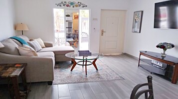 City House | Living area | 32-inch TV with cable channels