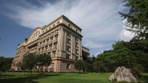 A large, historic building with a symmetrical facade, multiple windows, and a central entrance. - Laiya Boutique Hotel (Southwest University Zhuangyuanbei Subway Station) (Chongqing)