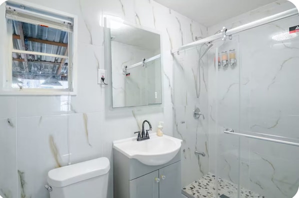 Shower, hair dryer, towels, soap