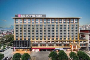 A multi-story hotel with a prominent sign at the top.