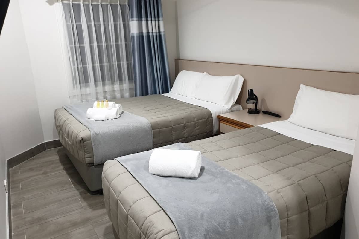 Standard Room, Multiple Beds | Desk, laptop workspace, iron/ironing board, free WiFi