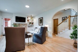 TV, fireplace, books, offices