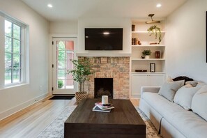 TV, fireplace, books, offices