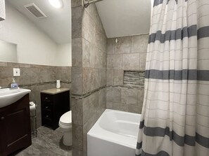 Shower, towels, soap, toilet paper