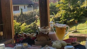 A breakfast table with various food items and a sign above reading "Burgundy".