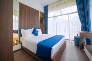 Villa Deluxe, varias camas | Ropa de cama de alta calidad, minibar, decoración individual