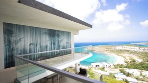 A modern building with a glass balcony overlooking a coastal area. - Numa Indigo BAY (INDIGO BAY)