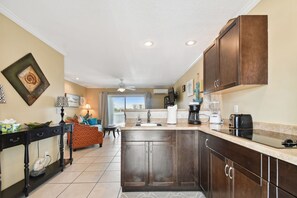 Fridge, microwave, stovetop, coffee/tea maker