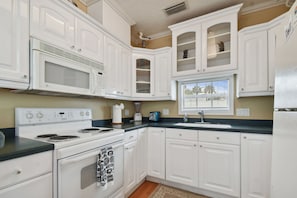 Fridge, microwave, stovetop, coffee/tea maker