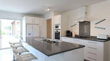 Coffee/tea maker, fridge, microwave, oven
