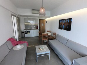 Apartment, 1 Bedroom, Partial Sea View | Living area | TV - ALOS SUITES  (Karpathos)