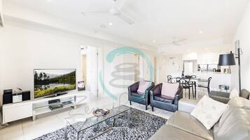 Comfort Condo | Living area | 50-inch Smart TV with cable channels, TV, Netflix