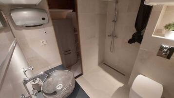 Shower, towels, soap, toilet paper