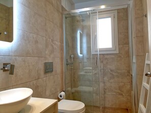 Shower, hair dryer, towels, soap