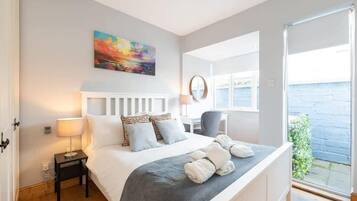 1 bedroom, desk, iron/ironing board, travel cot