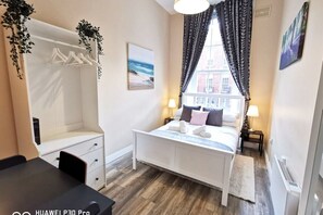 1 bedroom, desk, iron/ironing board, travel cot