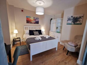 1 bedroom, desk, iron/ironing board, travel crib