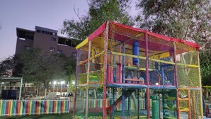 A playground with a climbing structure and ball pit. - Al Baiara Resort (Jericho)
