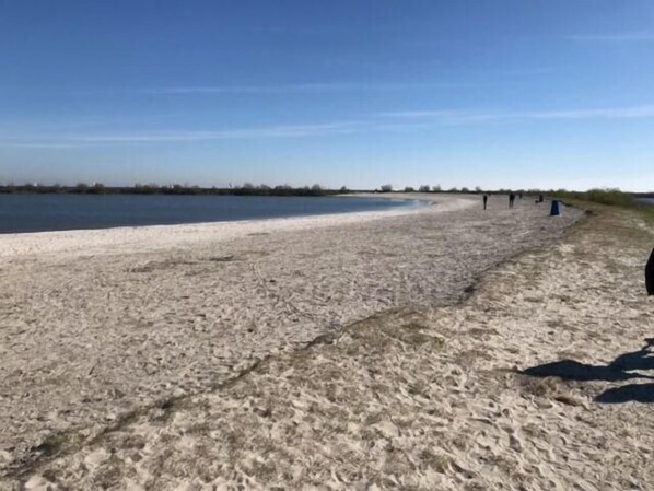 Enjoy a serene beach experience with access to the ocean and scenic views of the surrounding landscape.