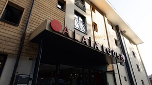 A building with a sign reading "AIA LODGE". - Alaia Lodge (Crans-Montana)