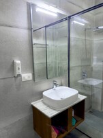 Shower, rainfall showerhead, hair dryer, towels