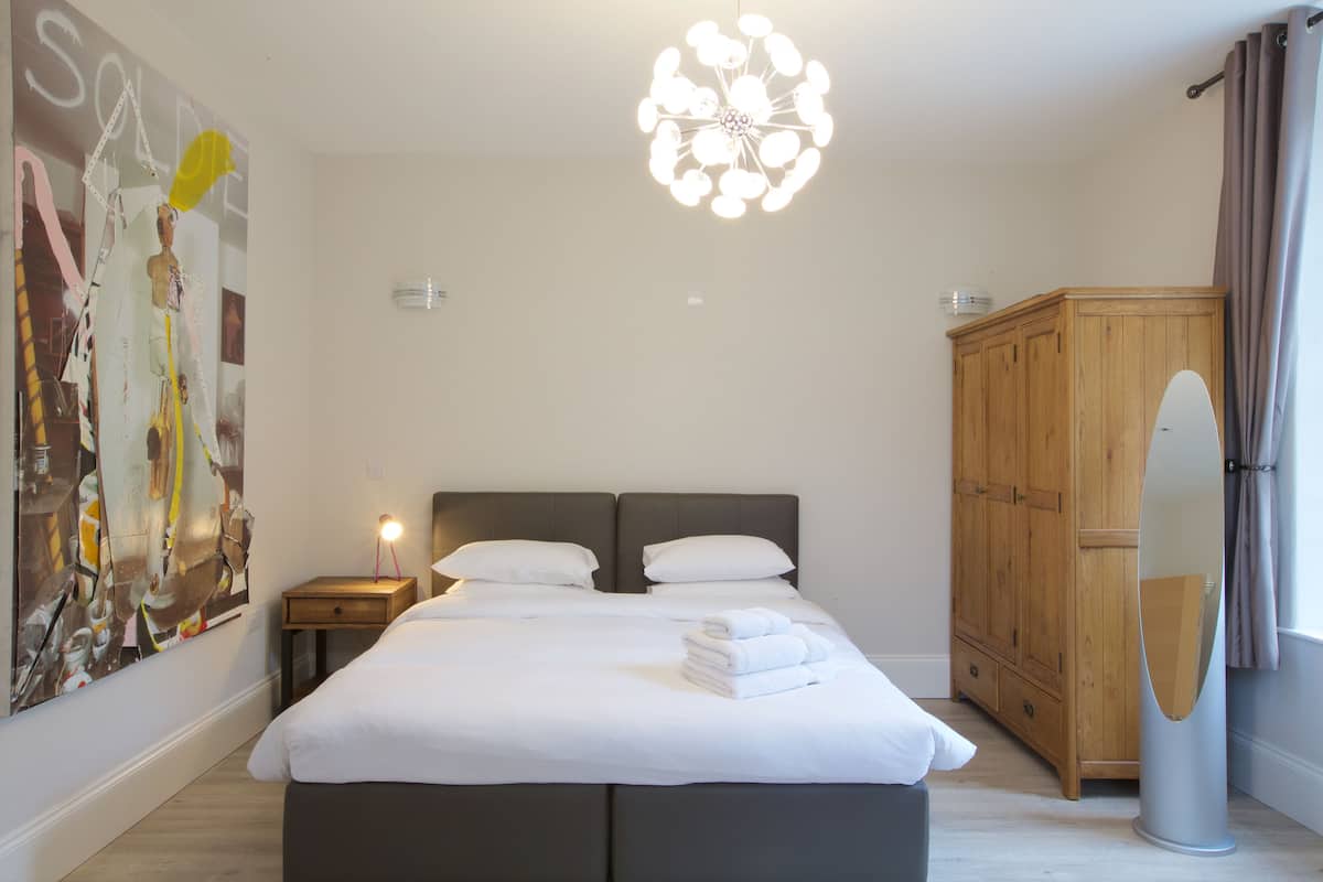 Premium bedding, memory-foam beds, desk, laptop workspace