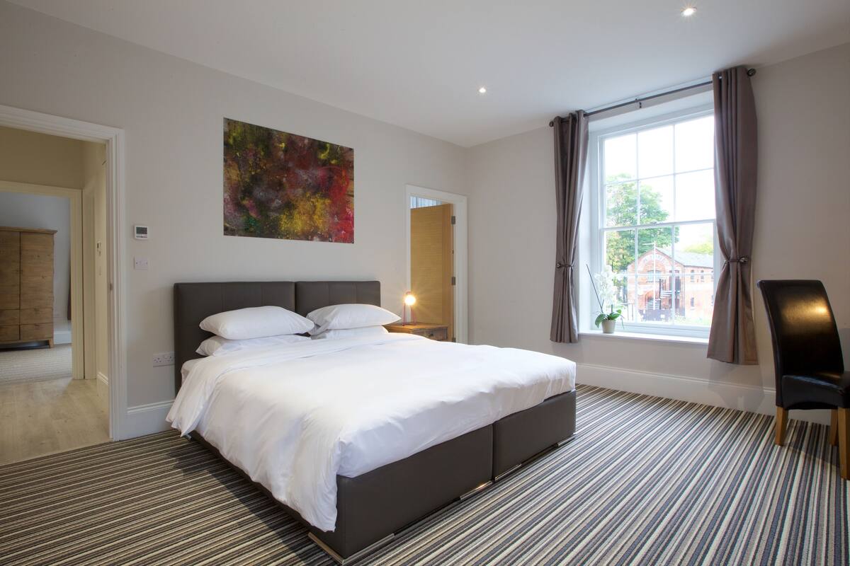 Premium bedding, memory-foam beds, desk, laptop workspace