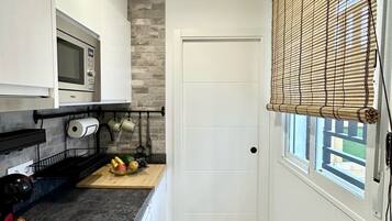 Studio Ville | Cuisine privée | Mini réfrigérateur, micro-ondes, plaque de cuisson, cafetiÚre/bouilloire