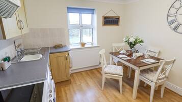Fridge, electric kettle, toaster, cookware/dishes/utensils