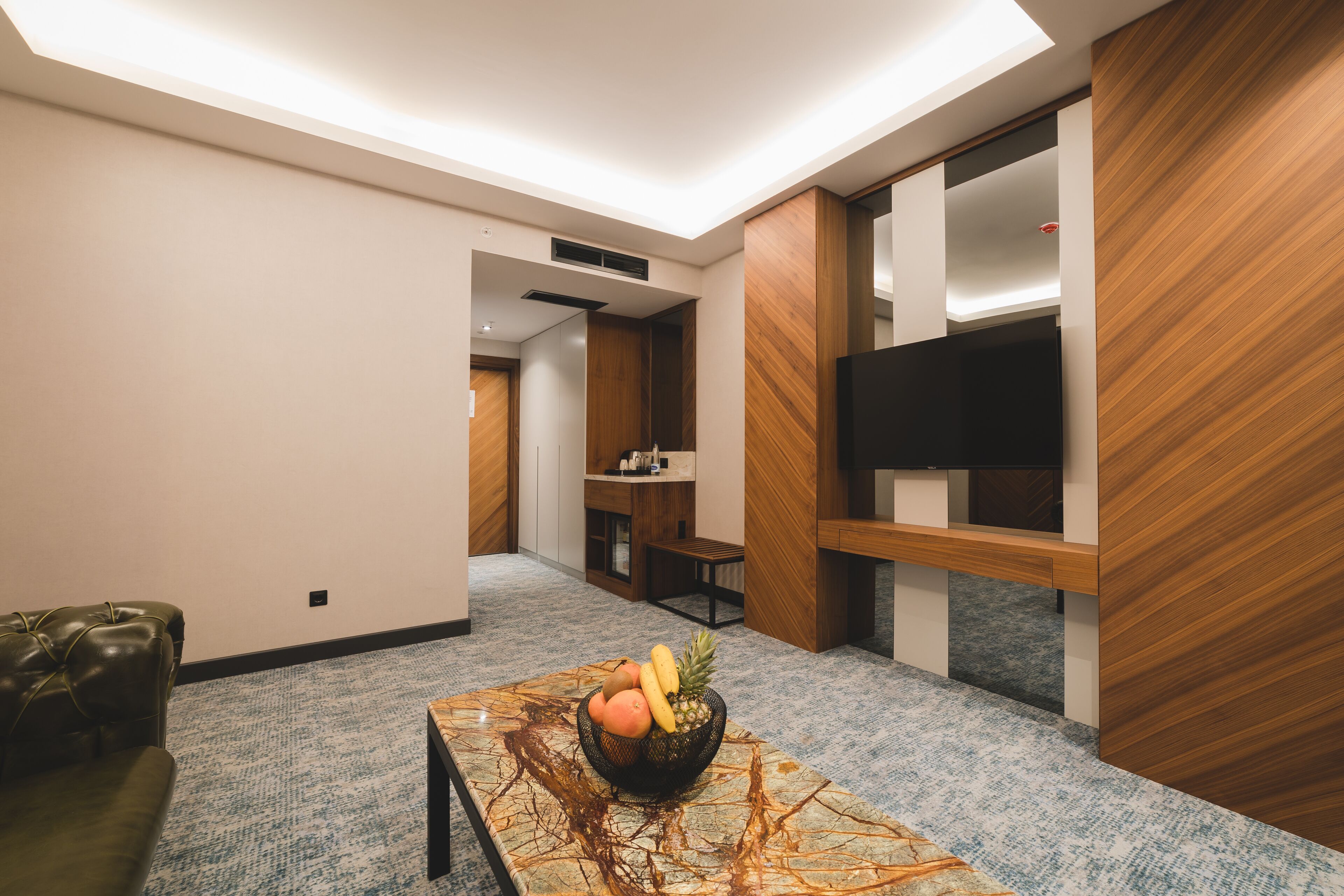 deluxe apartment, 1 bedroom, city view | living area | 43-inch smart tv with satellite channels, tv